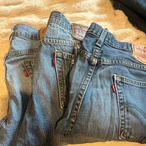 Levi's Classic Blue Denim Jeans with Distressed Details